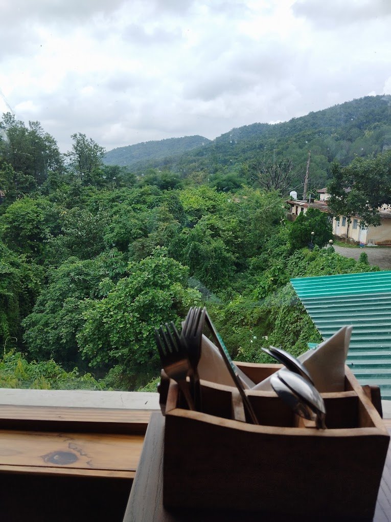 Panoramic mountain backdrop at Aristella best restaurant in Dehradun for family